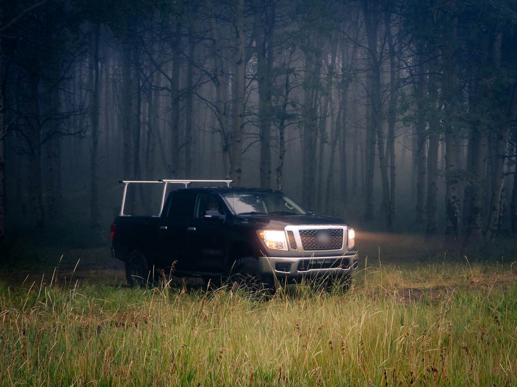 Work pickup with a ladder rack in a misty forest
